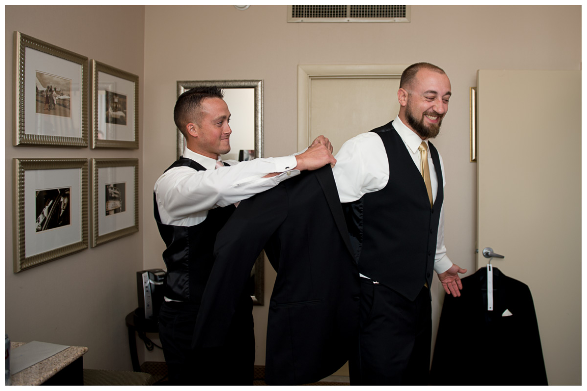 groom with best man getting ready on wedding day