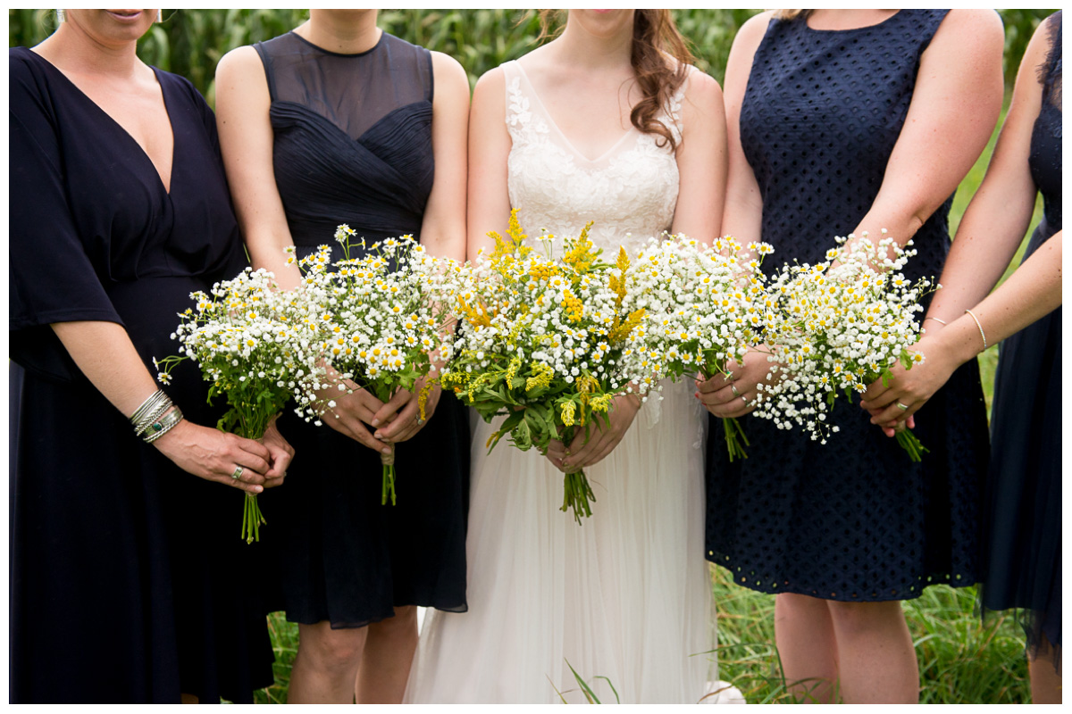 Wild flower wedding bouquets with babies breath and daisies