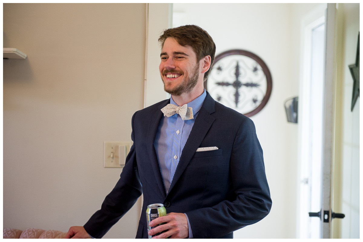 Groom with navy blue suit and bow tie 