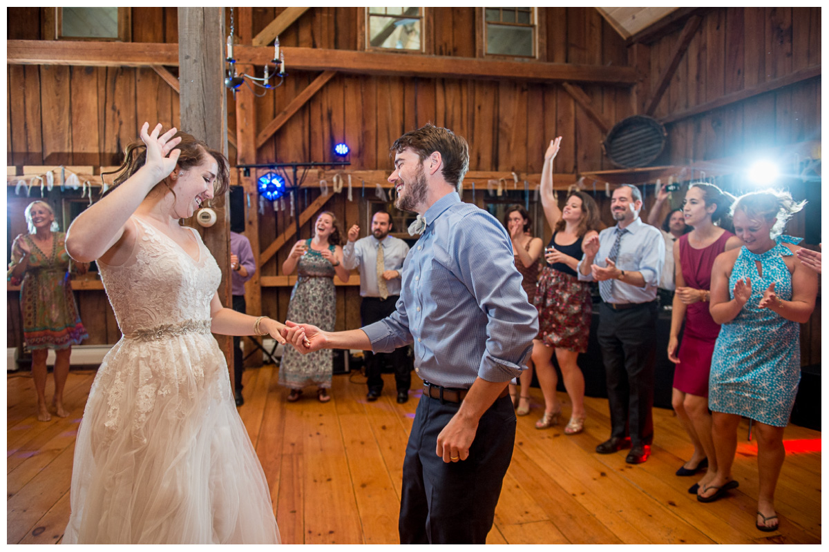 genuine couple dancing in a barn in New England 