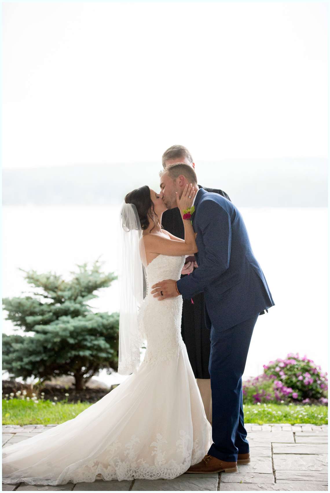 First kiss during wedding ceremony New Hampshire Lakeside